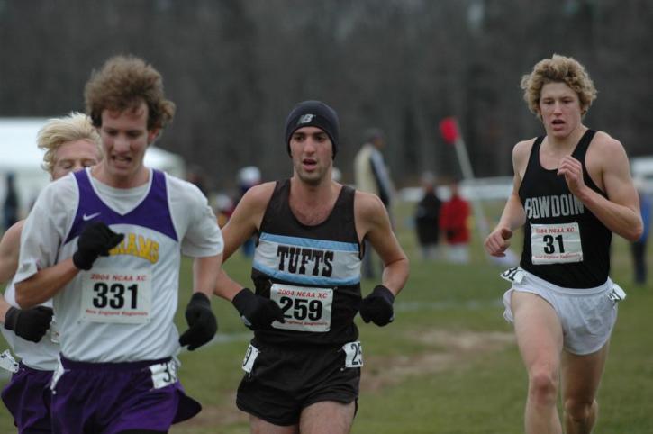 Josh Kennedy holding off Bowdoin's Andrew Combs.