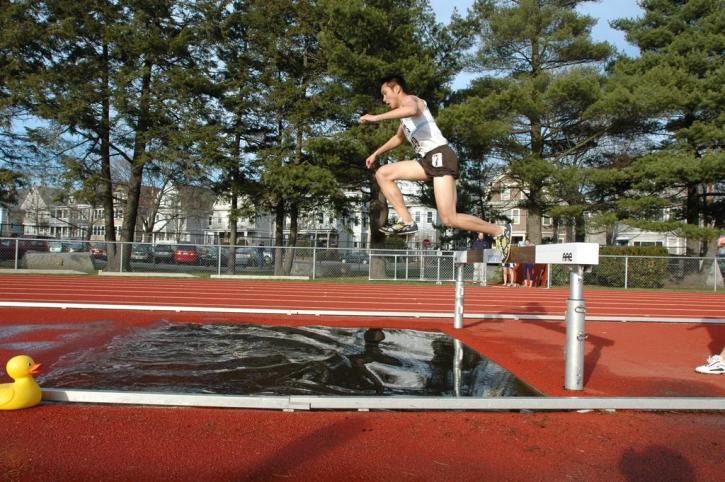 Chad Uy looks good on the water barrier in the 3k steeple.