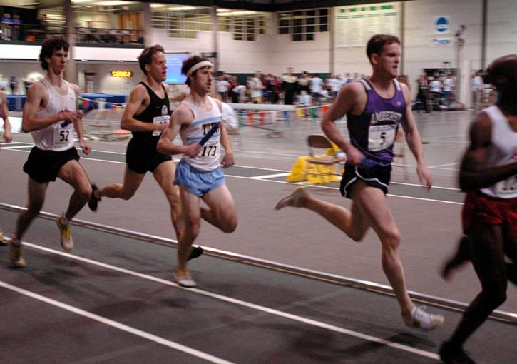 Pat Mahoney carries the baton for  Tufts in the 800 leg of the DMR.