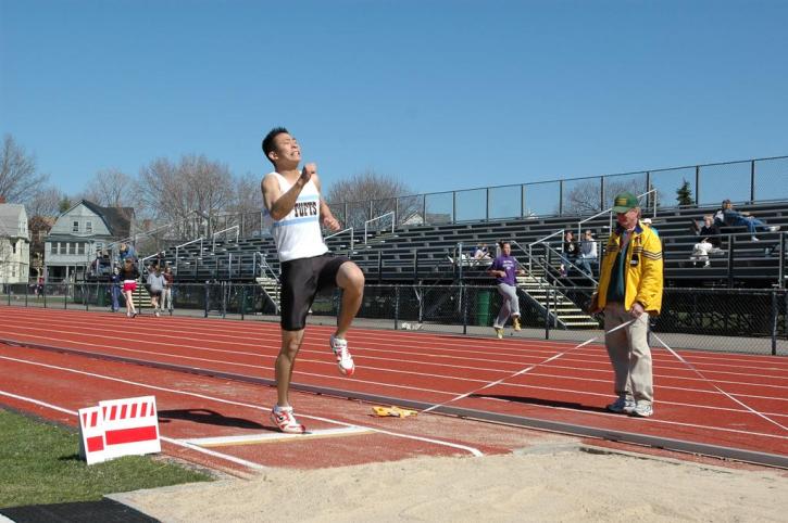 Kenneth Kang takes off in the long jump
