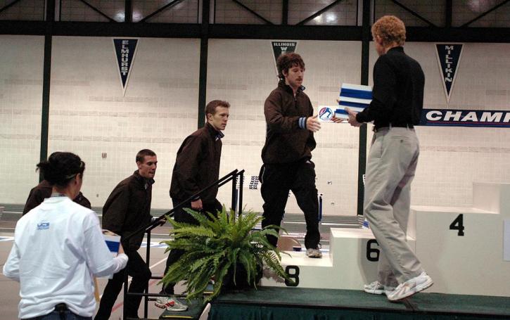Pat Mahoney, Trevor Williams, Matt Fortin and Aaron Kaye climb the podium to accept their awards for finishing 8th in the DMR.