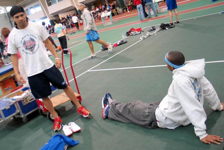 Nate Scott and Fred Jones stretch before the meet