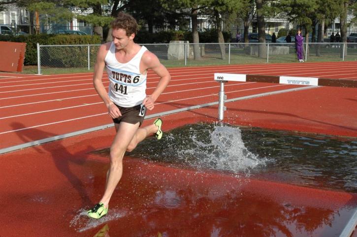 Brian McNamara navigates the water barrier cleanly in the 3k steeple.