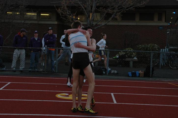 Nate Brigham and Matt Lacey celebrate after shattering the school record in the outdoor 5k.