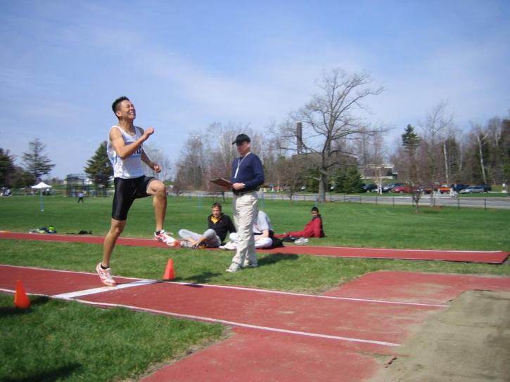 Kenneth Kang has a good takeoff in the long jump