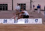 Fred Jones puts the finishing touches on an excellent long jump.
