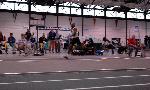 Fred Jones in middle of a triple jump.