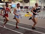 Matt Fortin runs alongside New England competion from Keene State and Bowdoin.