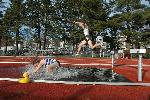 Dave Sorenson in mid air in the steeplechase.