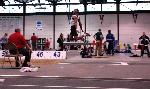 Fred Jones in the final stage of a triple jump.