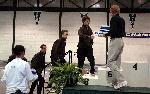 Pat Mahoney, Trevor Williams, Matt Fortin and Aaron Kaye climb the podium to accept their awards for finishing 8th in the DMR.