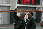 Officials doing their thing at high jump.