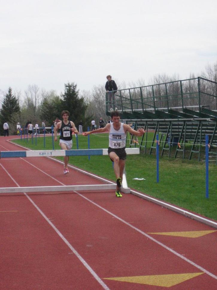 Josh Kennedy comes off a hurdle in the NESCAC Steeplechase