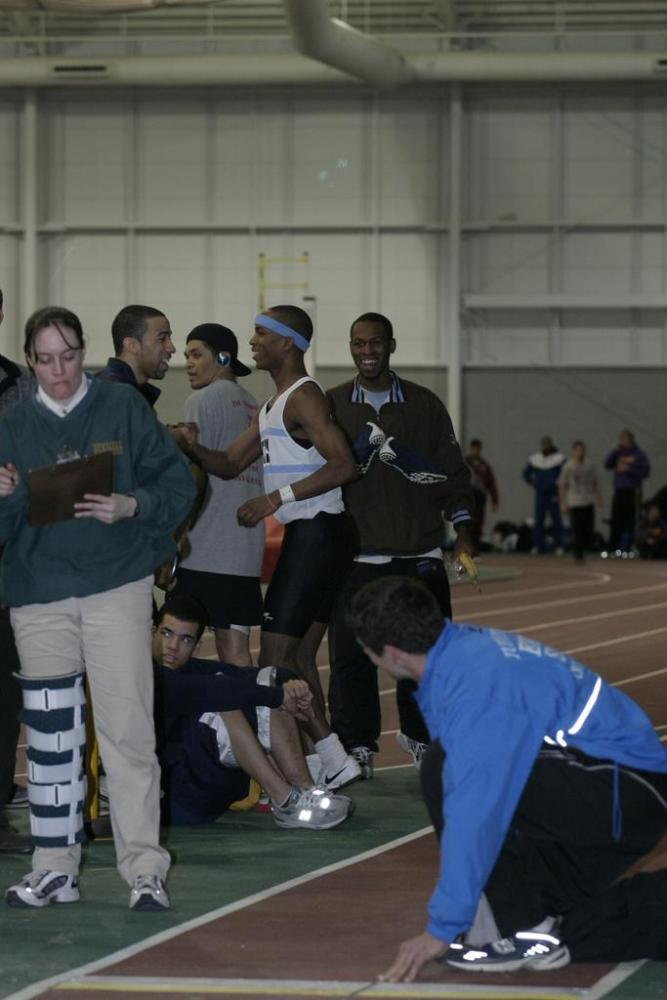 Fred Jones.  Officials recheck the distance