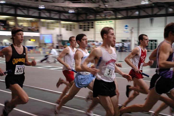 Aaron Kaye runs in traffic in the 1200 leg of the DMR.