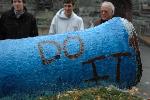 Brian McNamara, Josh Kennedy and Coach Connie Putnam admire the painted cannon.