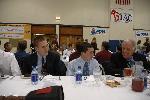 Nate Brigham and Matt Lacey chatting with Connie Putnam at the Dinner Banquet