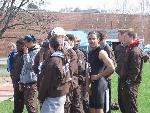 Nate Scott scratches an inch as other team members watch the long jump
