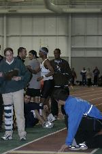 Fred Jones.  Officials recheck the distance
