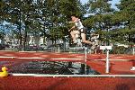 Chad Uy looks good on the water barrier in the 3k steeple.