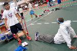 Nate Scott and Fred Jones stretch before the meet