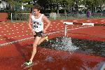 Brian McNamara navigates the water barrier cleanly in the 3k steeple.