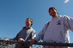 Pat Mahoney and Ethan Barron watch the meet