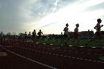 Mike Don and the other 5k competitors run the 5k as the sun begins to fall.