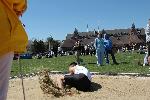 Kenny Kang lands in the long jump