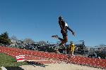 Fred Jones in mid-flight during the long jump